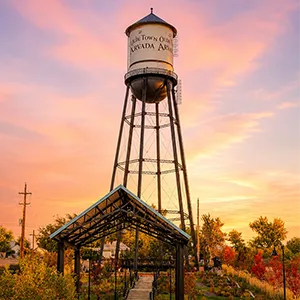 Olde Town Arvada water tower and park at golden hour
