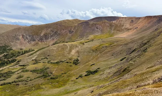 Alpine tundra valley with rugged mountain slopes near Alpine Visitor Center