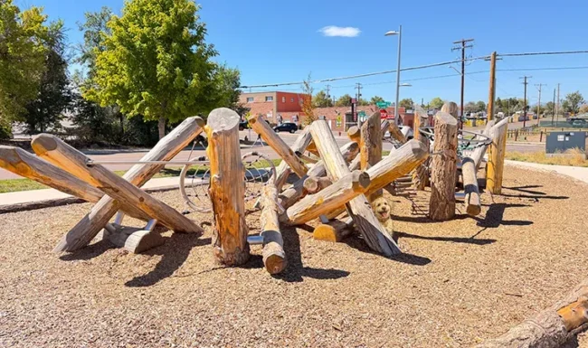 Natural log climbing structure at Westminster Station Park Nature Playground