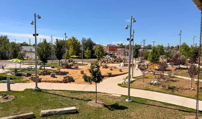 Overview of sand, log and climbing play areas at Westminster Station Park Nature Playground