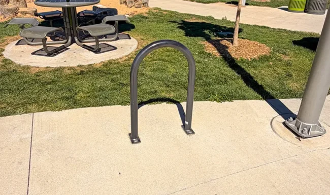 Bike rack, shaded picnic table and nature playground at Westminster Station Park