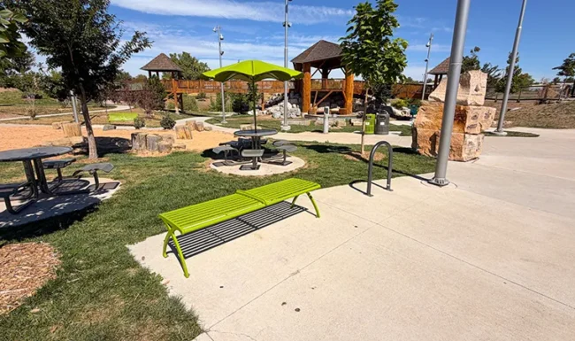 Picnic tables, park bench and nature playground at Westminster Station Park