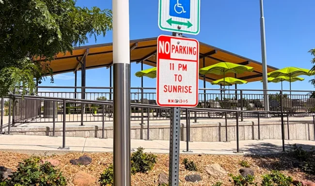 Accessible reserved parking sign near the picnic pavilion at Westminster Station Park