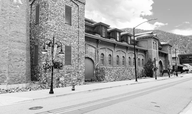 Historic Colorado Central Station red-brick and stone building on a downtown Black Hawk street