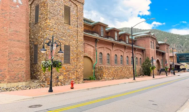 Historic Colorado Central Station red-brick and stone building on a downtown Black Hawk street