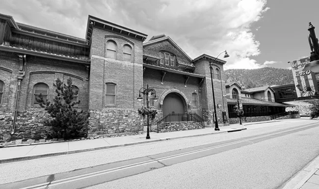 Historic Colorado Central Station red-brick and stone building on a downtown Black Hawk street
