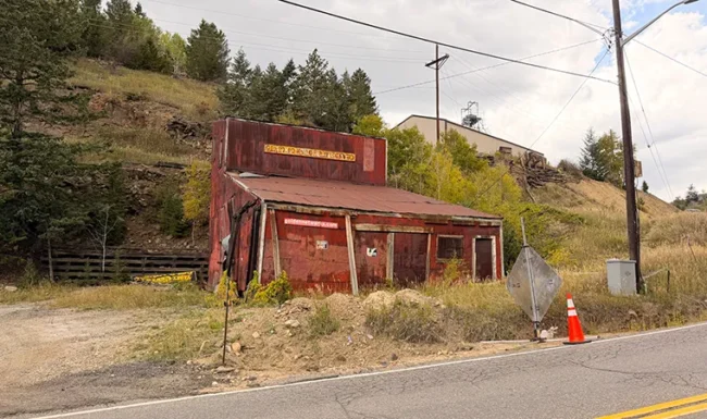Weathered historic mining building along a road in Black Hawk, Colorado