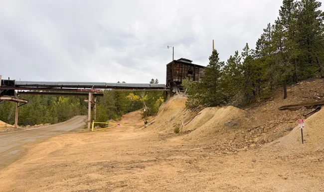 Historic mining structure above a dirt road near Central City, Colorado