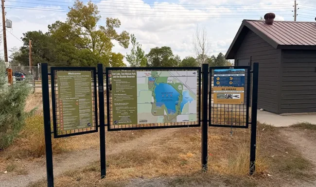 Coot Lake trail map, visitor information, and restroom building