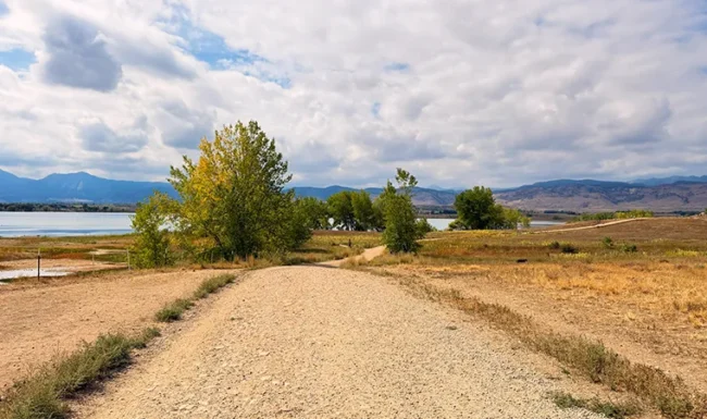 Gravel trail leading toward Boulder Reservoir with Front Range views