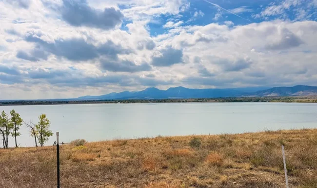 Wide view across Boulder Reservoir beneath dramatic clouds