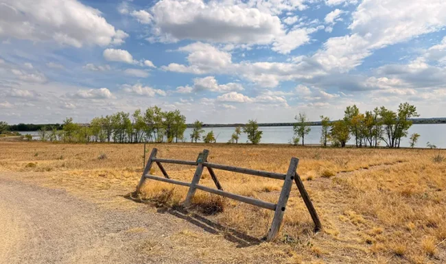 Rustic fence and open shoreline at Boulder Reservoir