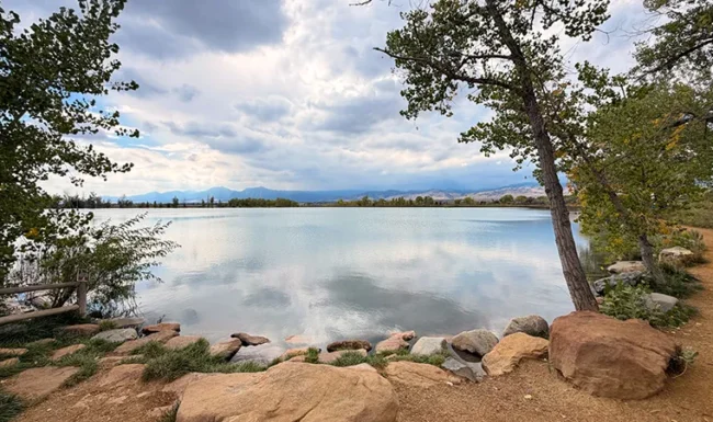 Rocky shoreline and calm water at Coot Lake