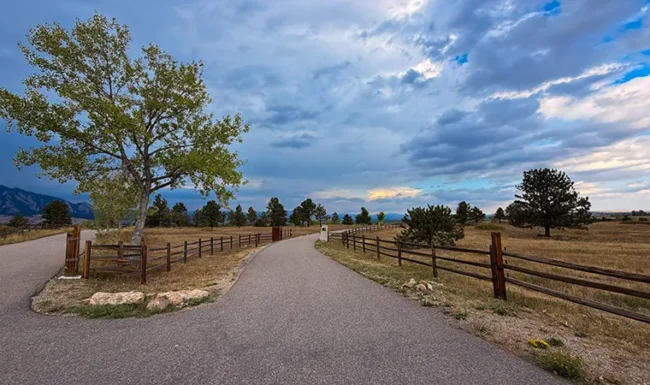 Country road and ranch fence with foothill views near Eldorado Canyon