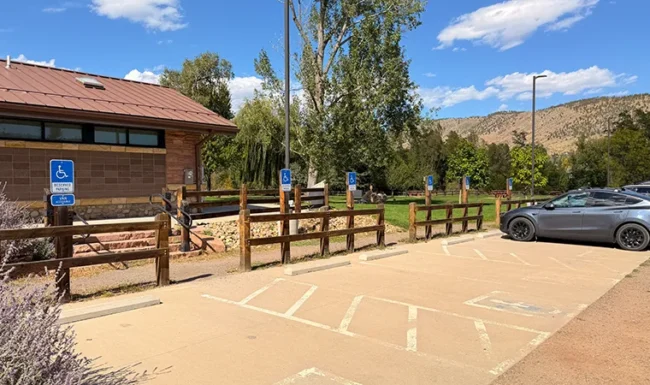 Accessible parking spaces beside the Bohn Park restroom building in Lyons, Colorado