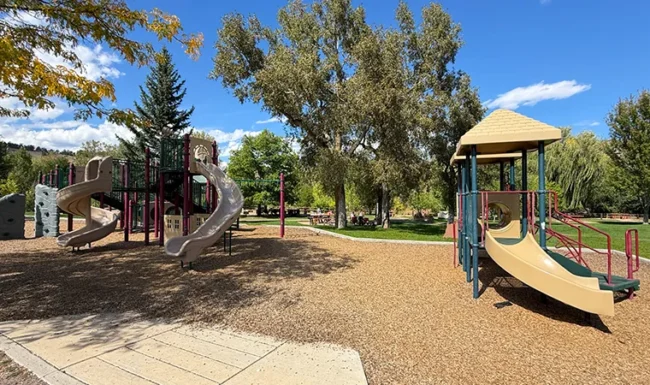 Two playground structures with slides at Bohn Park in Lyons, Colorado