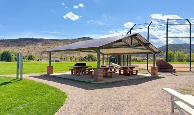 Open-air picnic pavilion with tables at Bohn Park in Lyons, Colorado