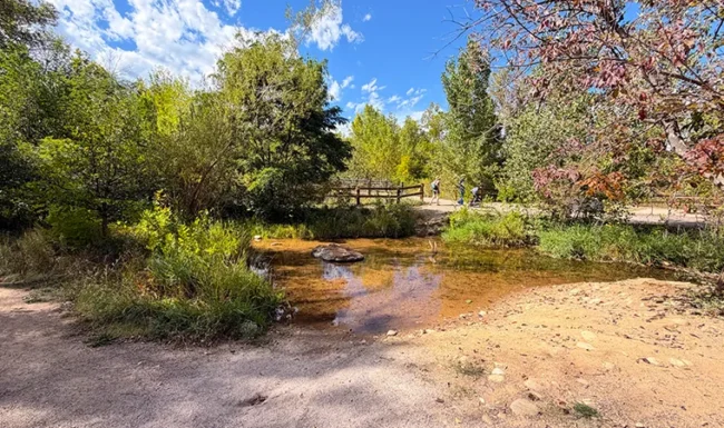 Shallow St. Vrain Creek river access beside the walking path at Bohn Park in Lyons, Colorado