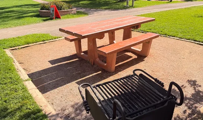 Picnic table and charcoal grill at Bohn Park in Lyons, Colorado