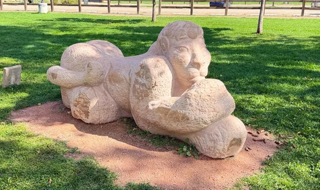 Outdoor Lion sculpture in the open lawn at Bohn Park in Lyons, Colorado