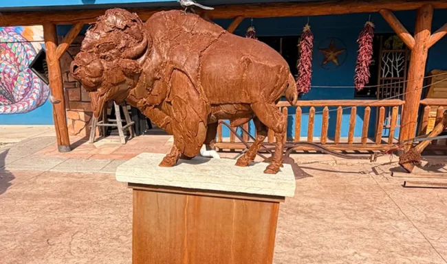 Metal bison sculpture outside a downtown Lyons business