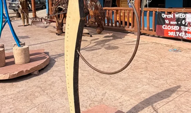 Metal hawk sculpture outside a downtown Lyons business