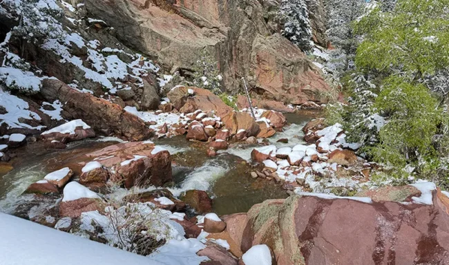 South Boulder Creek flowing past snow-covered rocks in Eldorado Canyon