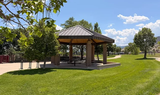 Picnic shelter and grassy lawn at Foothills Community Park in Boulder Colorado