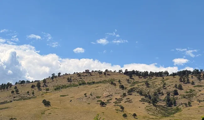 Paraglider above the foothills near Foothills Community Park in Boulder Colorado