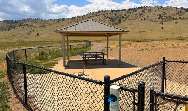 Shaded picnic shelter inside the dog park at Foothills Community Park in Boulder Colorado