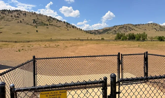 Fenced off-leash dog park with foothill views at Foothills Community Park in Boulder Colorado