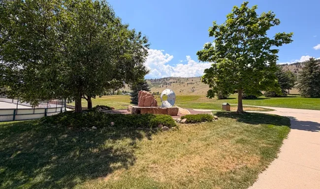 Nature play area with climbing features at Foothills Community Park in Boulder Colorado