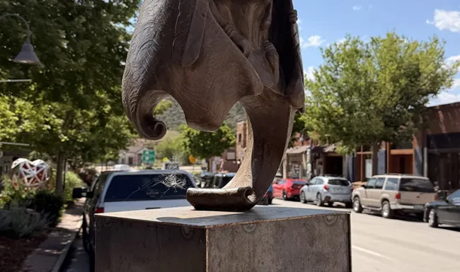 Bronze Native American themed sculpture along Main Street in downtown Lyons