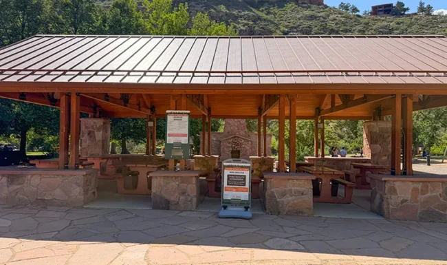 Large covered picnic pavilion with tables at LaVern M. Johnson Park in Lyons