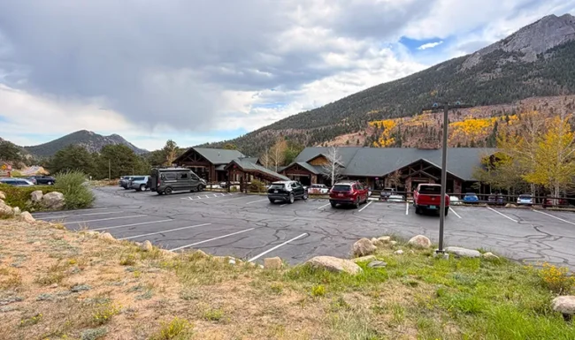 Fall River Gateway Visitor Center parking area with Rocky Mountain views in Estes Par
