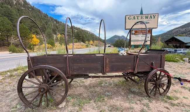 Historic covered wagon with Zero looking out. He prefers my truck!